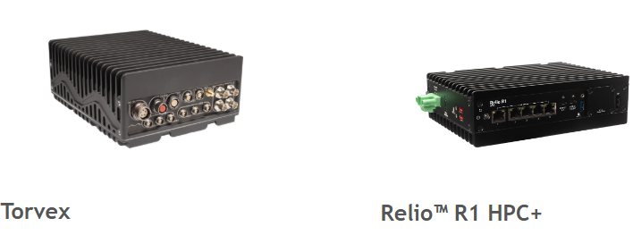 Photograph showing two compact industrial computers side by side, labeled Torvex and Relio R1 HPC+. Both devices feature rugged black metal casings with multiple ports and connectors visible on front panels, highlighting differences in design and connectivity options.