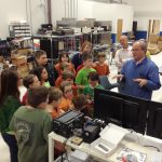 Bobby Richardson, Director of Operations at Sealevel Systems Inc., demonstrates circuit board assembly to Crosswell Elementary STEM Club.