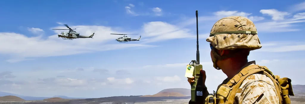 Soldier looking at helicopters